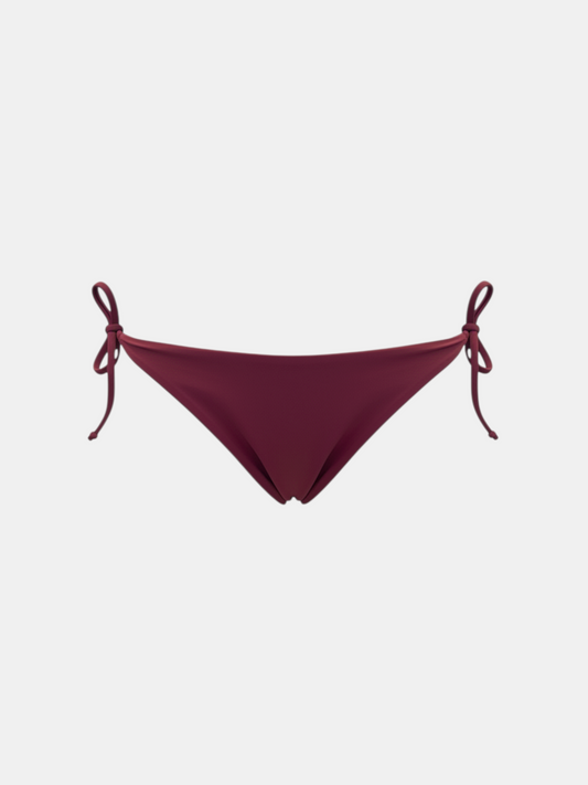 THE FASHION LIBRARY deep burgundy bikini bottoms featuring adjustable side tie closures in a minimalist style.