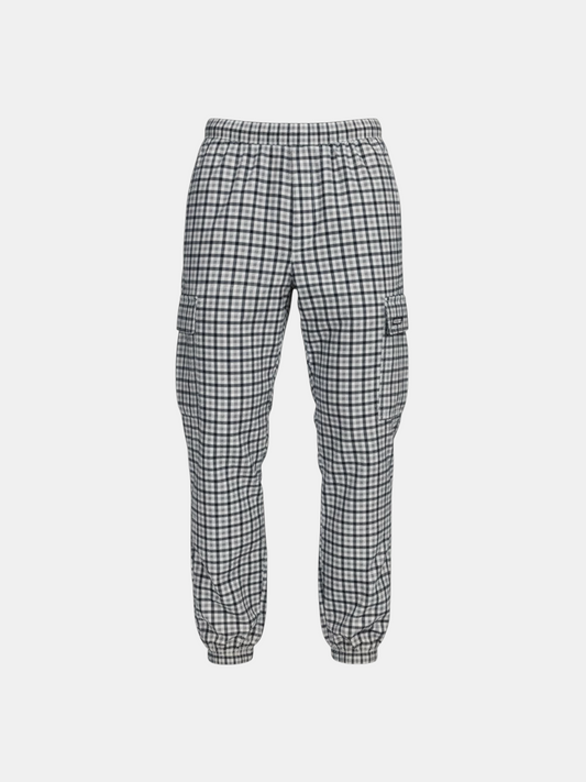 THE FASHION LIBRARY Palace chequered tracksuit pants in black and white with cargo pockets and elasticated cuffs.