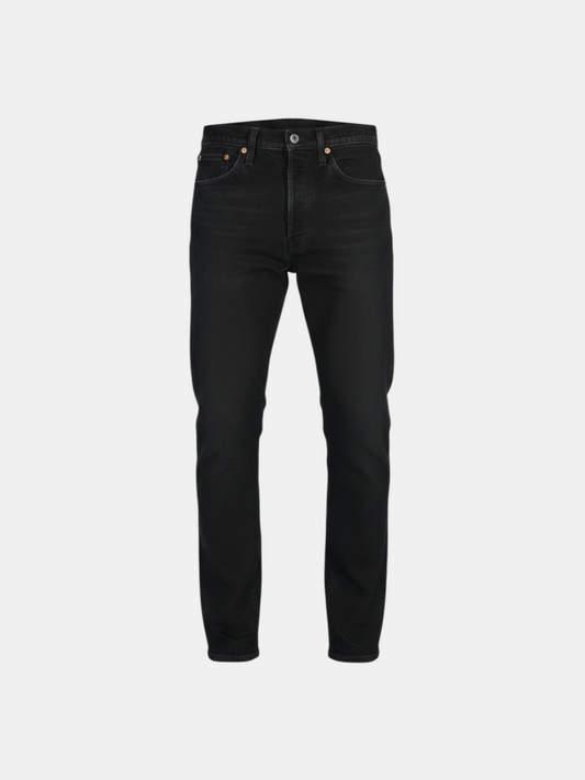 THE FASHION LIBRARY Levi's 501 Skinny jeans in black denim with a classic button fly and slim fit silhouette.
