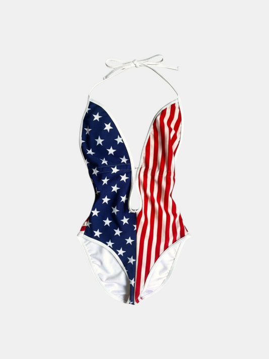 THE FASHION LIBRARY American Apparel low cut one-piece swimsuit featuring a patriotic stars and stripes flag print.